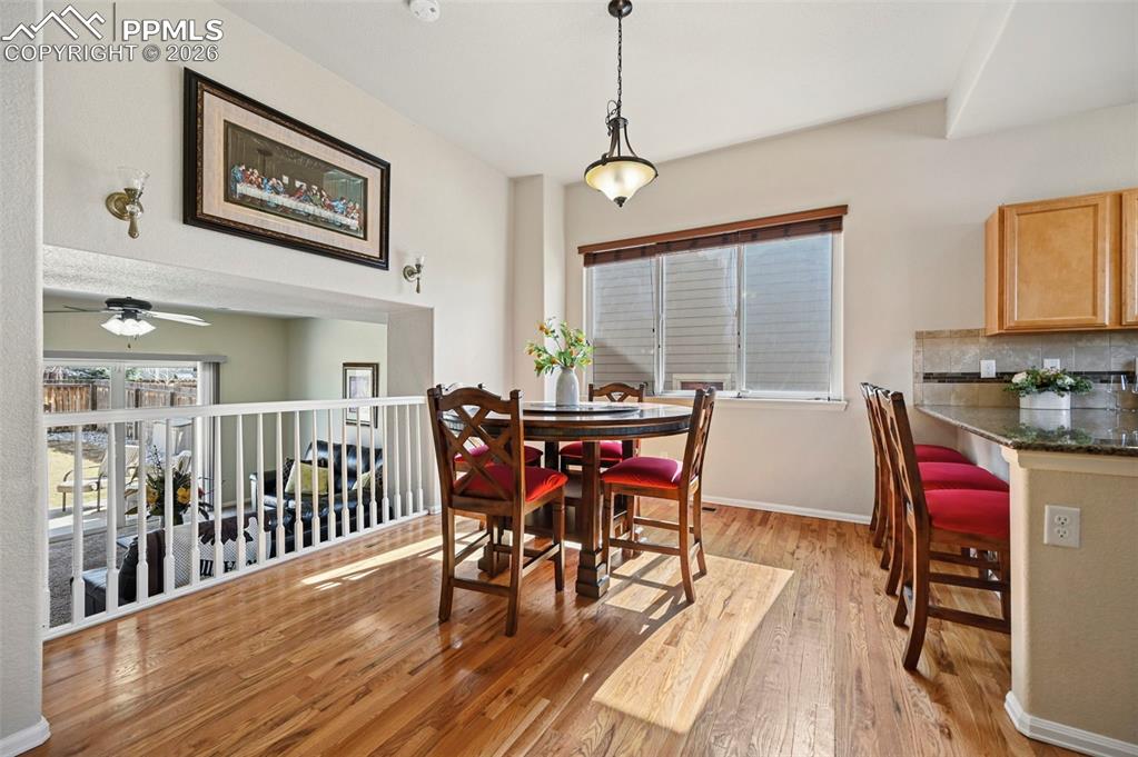 Image 8 of 44: Open and spacious dining room featuing beautiful hardwood floors and lots o