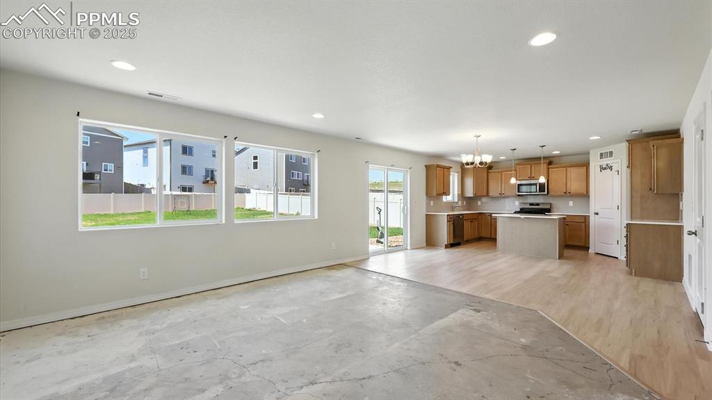 Image 11 of 50: Open floor plan where one room flows effortlessly into another.