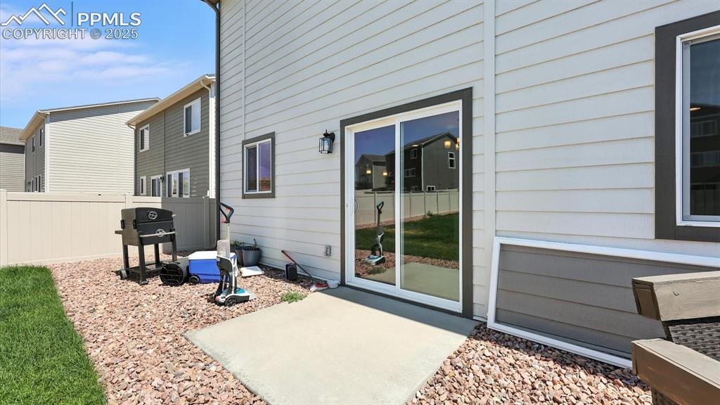 Image 17 of 50: Backyard patio located off the Dining Area.