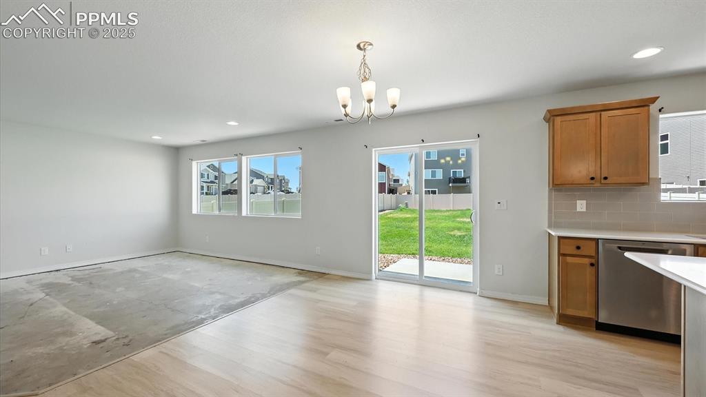 Image 20 of 50: View of the walk out Dining Area and Living Room from the Living Room.