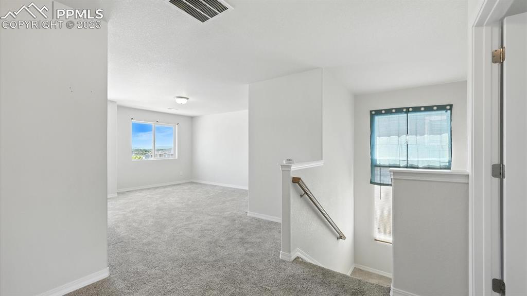 Image 23 of 50: Upper Level Loft provides flexible living space, ideal as a 2nd living area