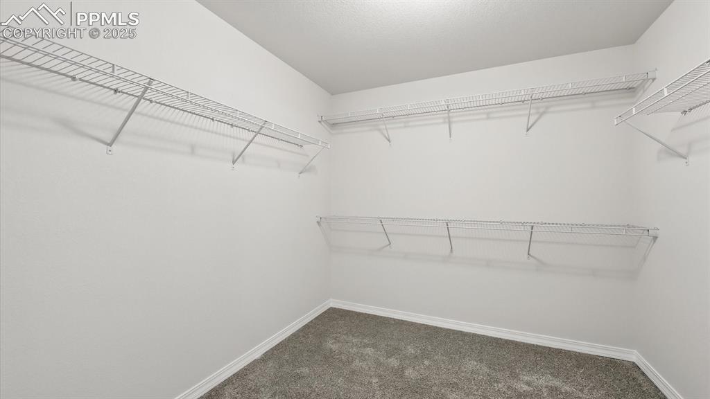 Image 37 of 50: Walk in closet for Primary Bedroom