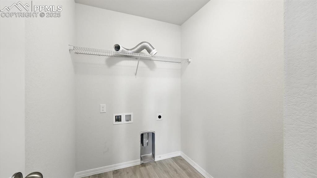 Image 38 of 50: Upper Level Laundry Room with electric hookup.