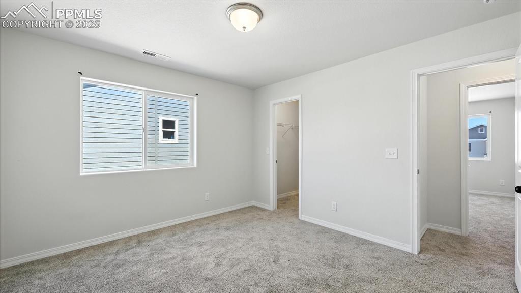 Image 44 of 50: Upper Level Bedroom #3 has a walk in closet.