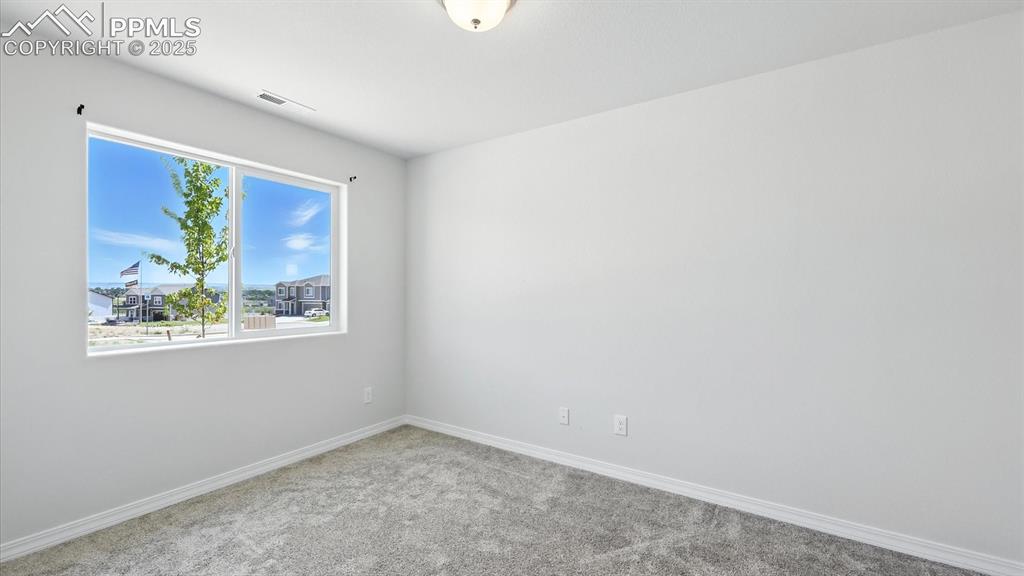 Image 5 of 50: Home Office with neutral carpet.