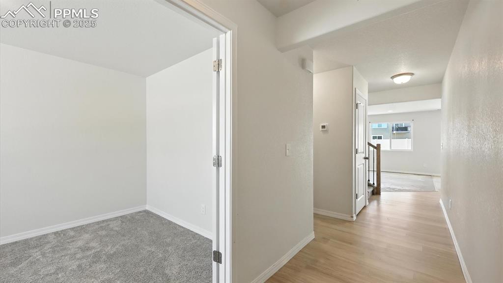 Image 7 of 50: Attractive LVP Floors through the entry way into the Living Room.
