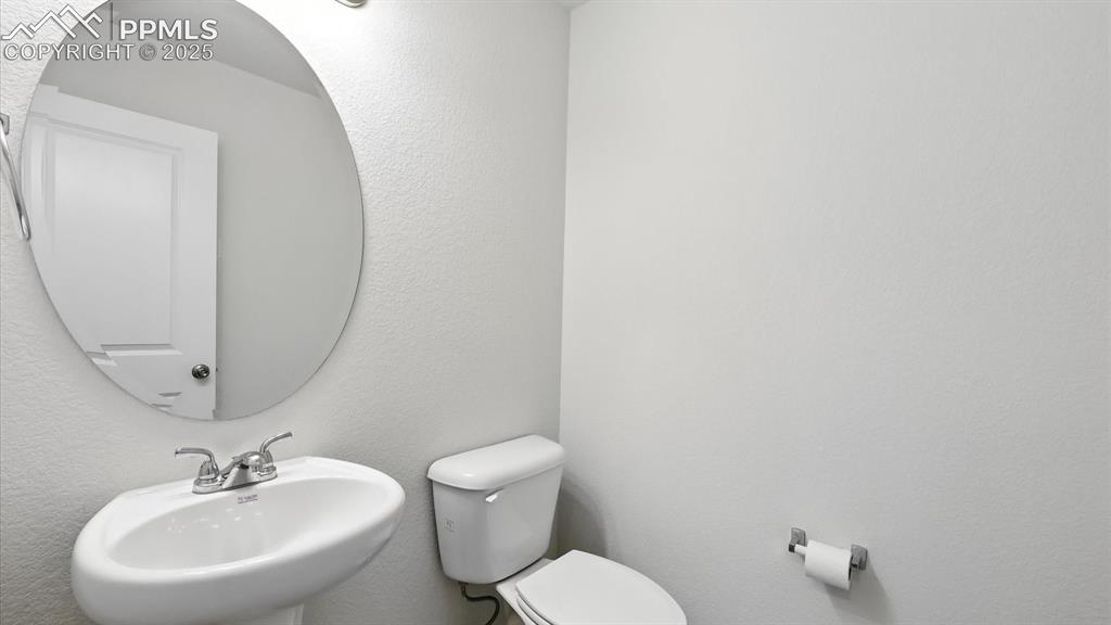 Image 8 of 50: Main Level Powder Bathroom.