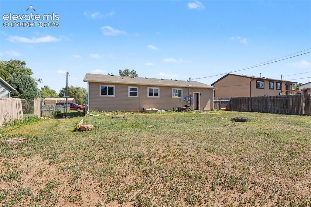Image 20 of 25: The home features a large backyard area to enjoy the outdoors from the comf