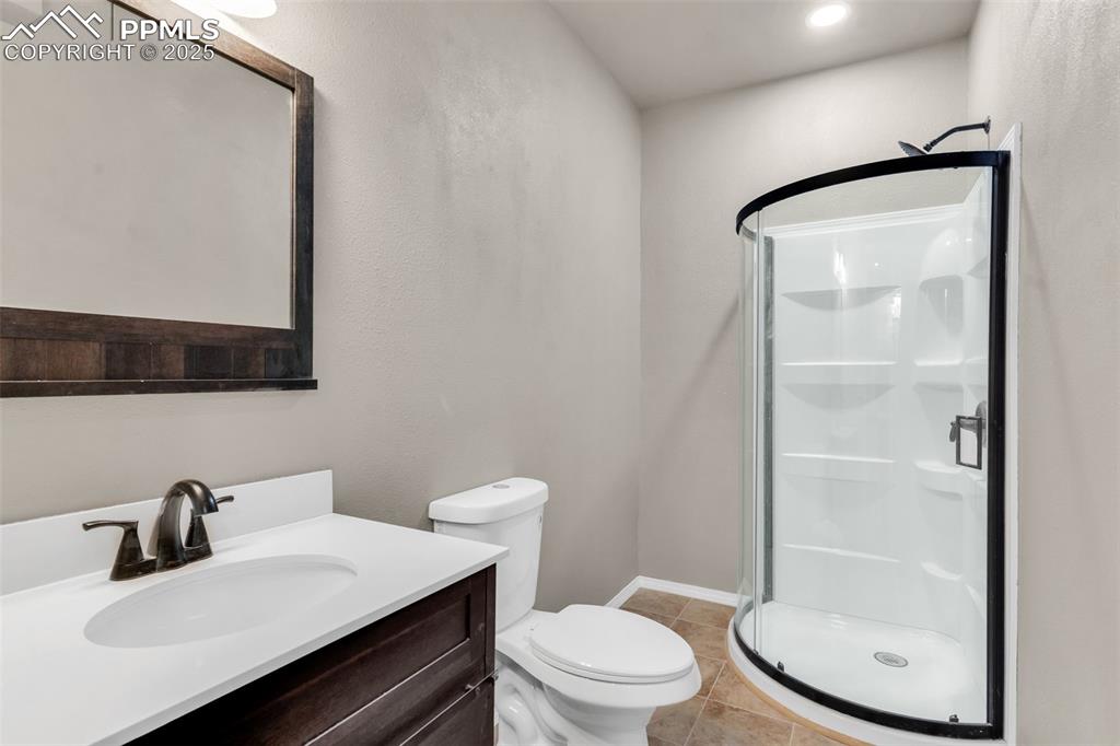 Image 32 of 37: 3/4 bathroom adjacent to the fourth bedroom in the basement