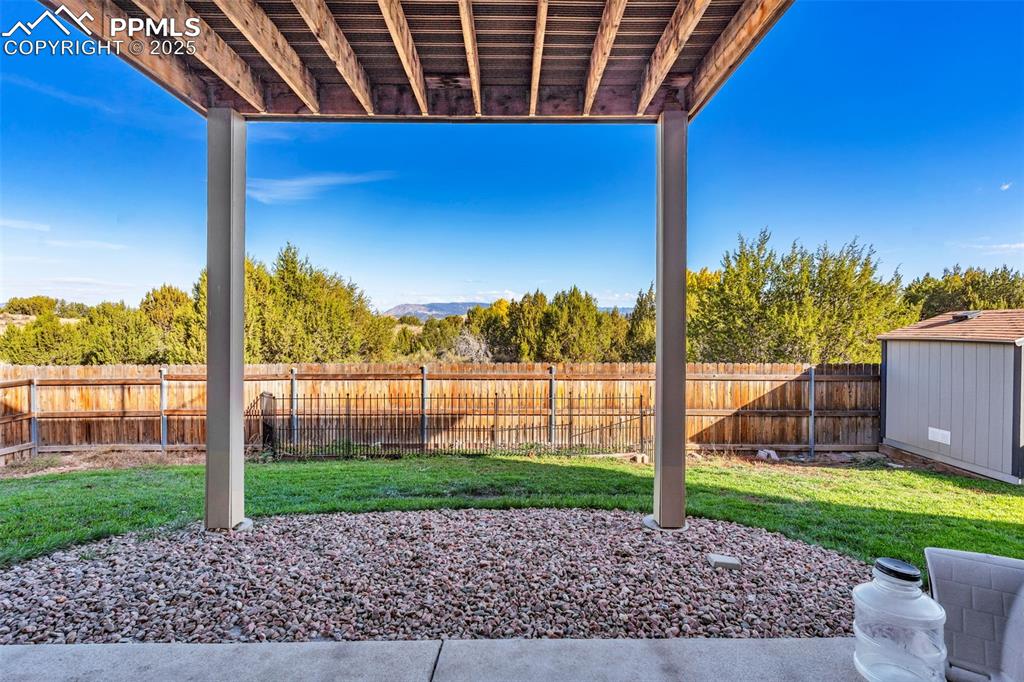Image 35 of 37: Fully fenced and landscaped yard offer privacy and space!