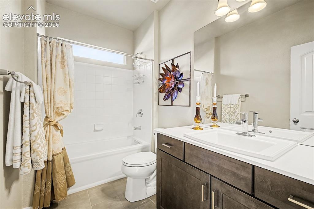 Image 11 of 45: Beautifully appointed full bath on the main level complements the secondary