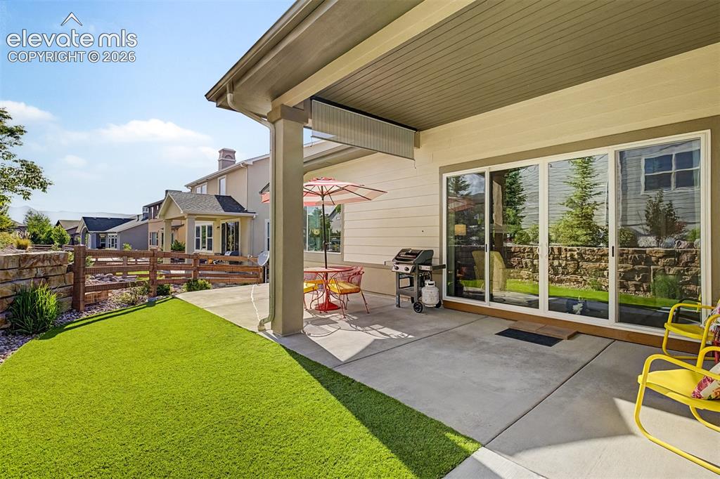 Image 15 of 45: Covered patio positioned just off the living room extends the home’s living