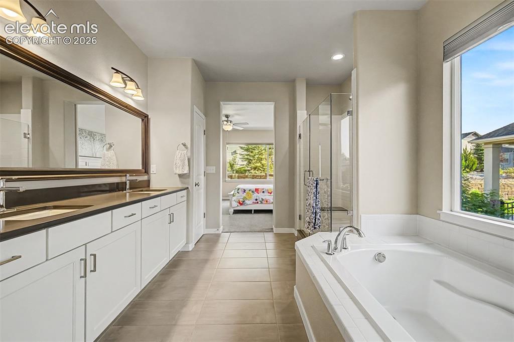 Image 27 of 45: Dual vanity with undermount sinks and contemporary hardware