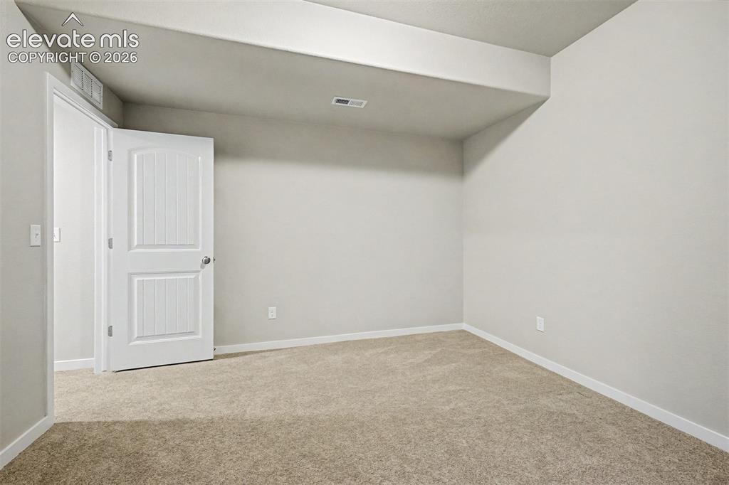Image 34 of 45: Second lower level bedroom