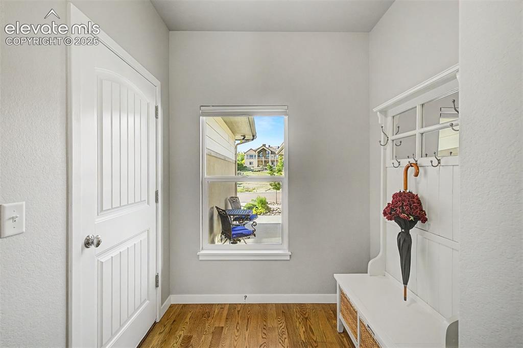 Image 6 of 45: Thoughtfully designed mudroom off the garage keeps everyday drop-zone items