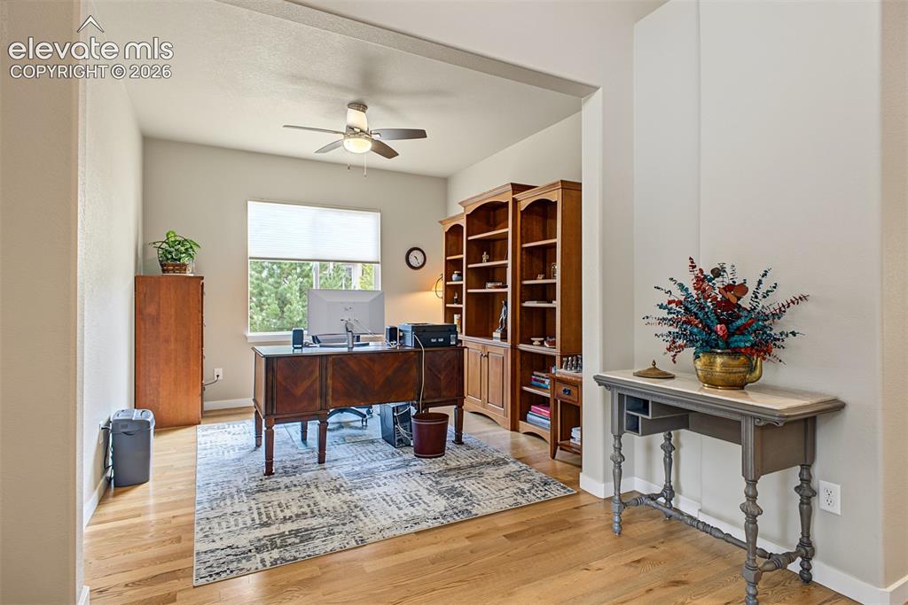 Image 7 of 45: A private den just off the main living area offers a bright, comfortable sp