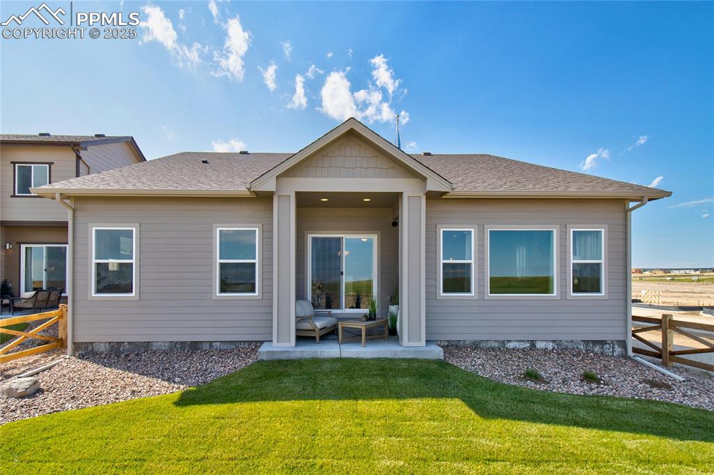 Image 24 of 34: Rear view of house featuring a patio and a shingled roof