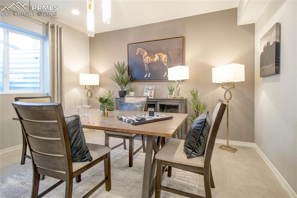 Image 27 of 34: Carpeted office with baseboards