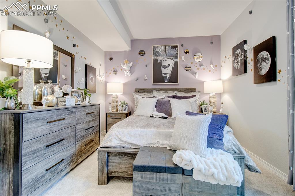 Image 33 of 34: Bedroom with light carpet and baseboards