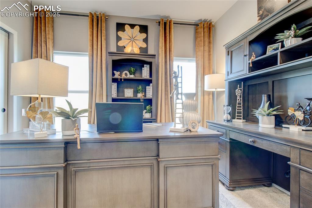 Image 7 of 34: Home office with built in study area