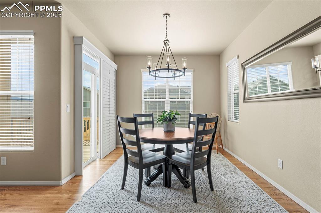 Image 20 of 44: Dining room with a chandelier, healthy amount of natural light, and light w