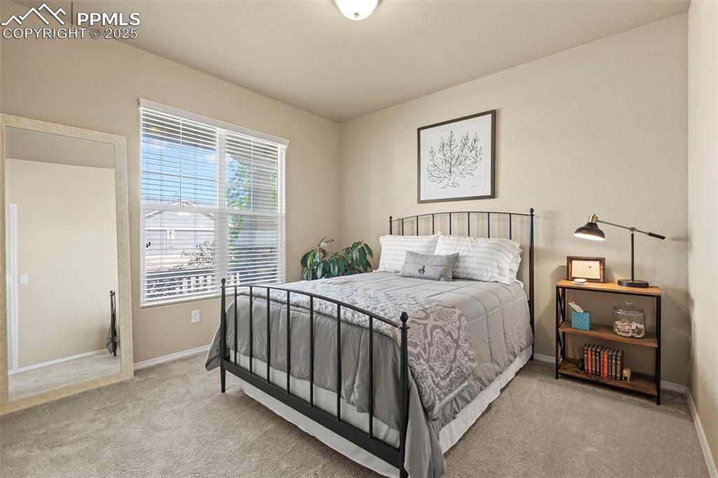 Image 30 of 44: Carpeted bedroom featuring baseboards