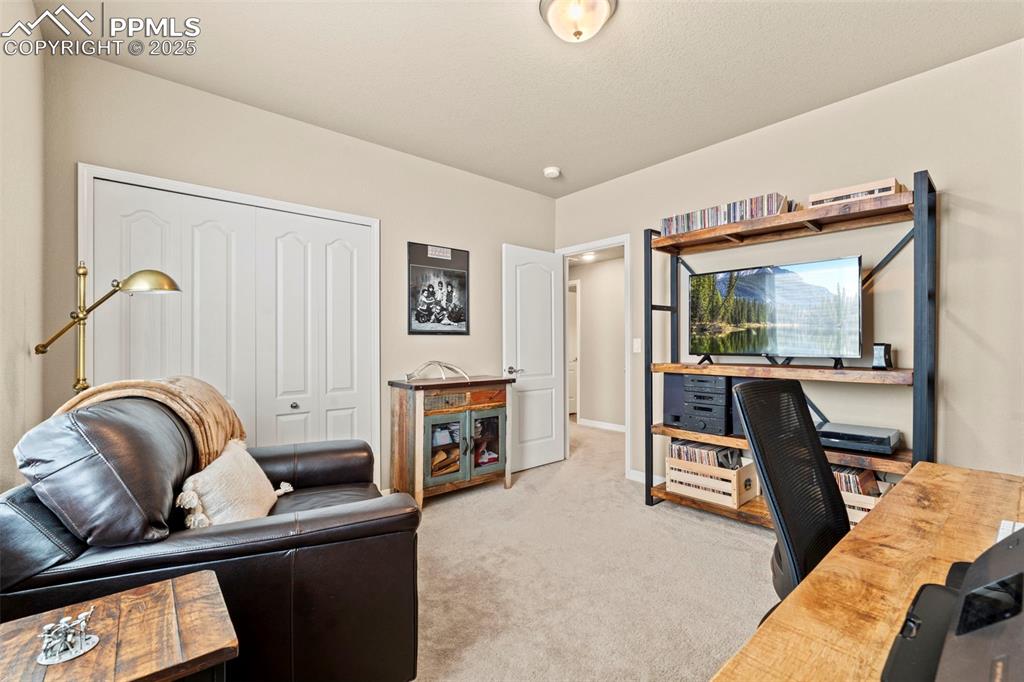 Image 38 of 44: Office featuring light carpet and baseboards
