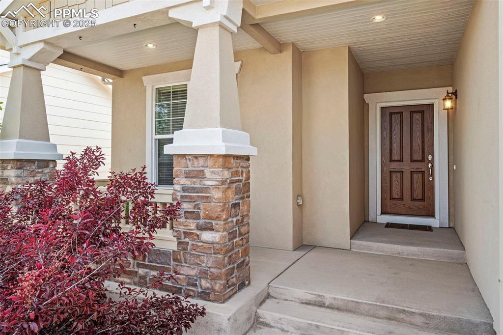 Image 4 of 44: View of exterior entry featuring stucco siding