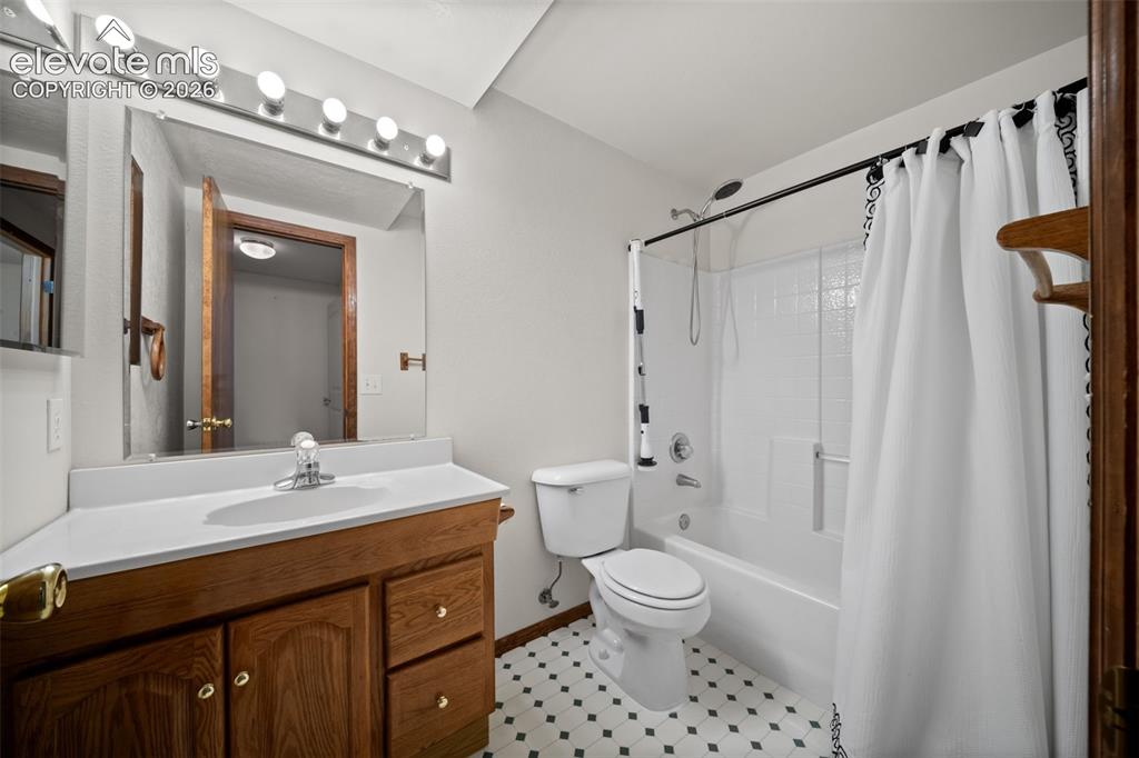 Image 34 of 48: White vanity countertop with integrated sink and chrome faucet