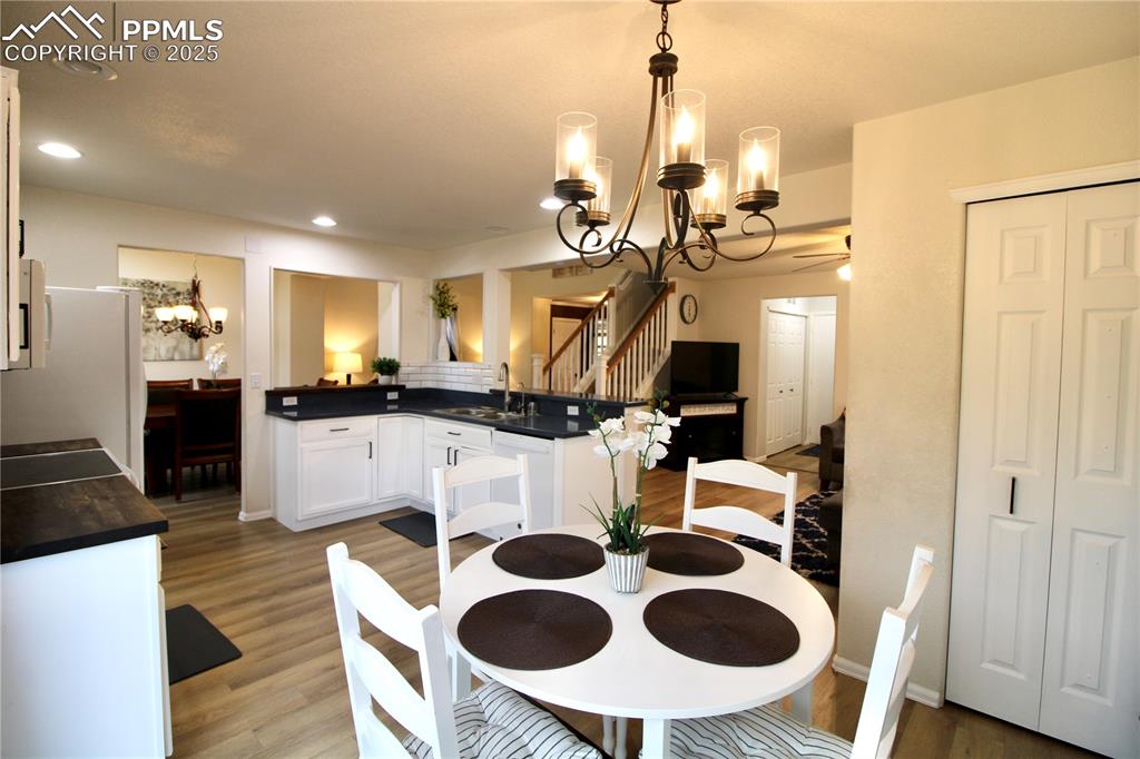 Image 13 of 50: Eating area featuring wall of cabinets
