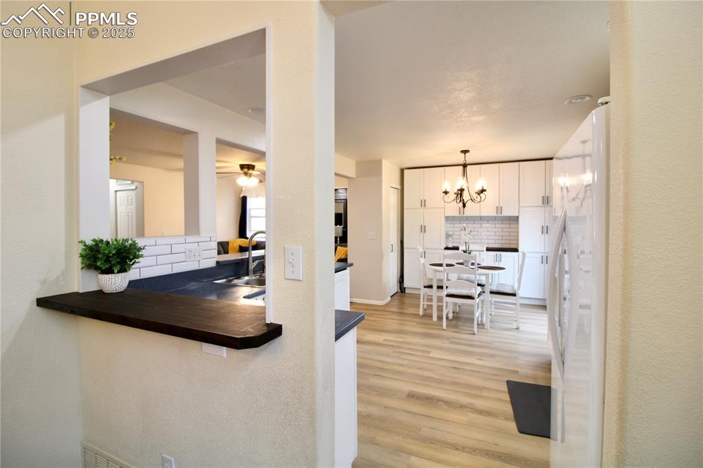 Image 16 of 50: Kitchen featuring corian countertops and butcher block countertops