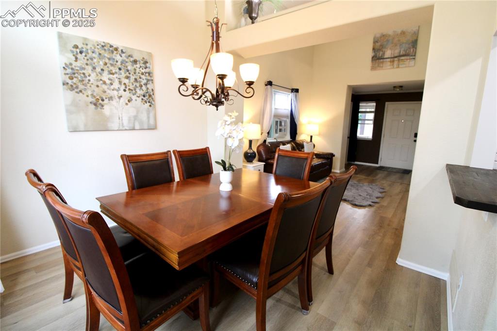 Image 8 of 50: Living area opening to kitchen and breakfast bar