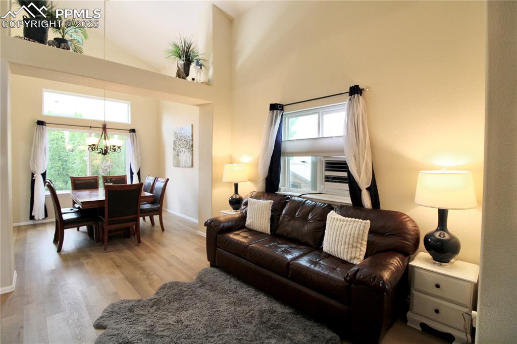 Image 9 of 50: Dining area featuring a chandelier on a dimmer switch