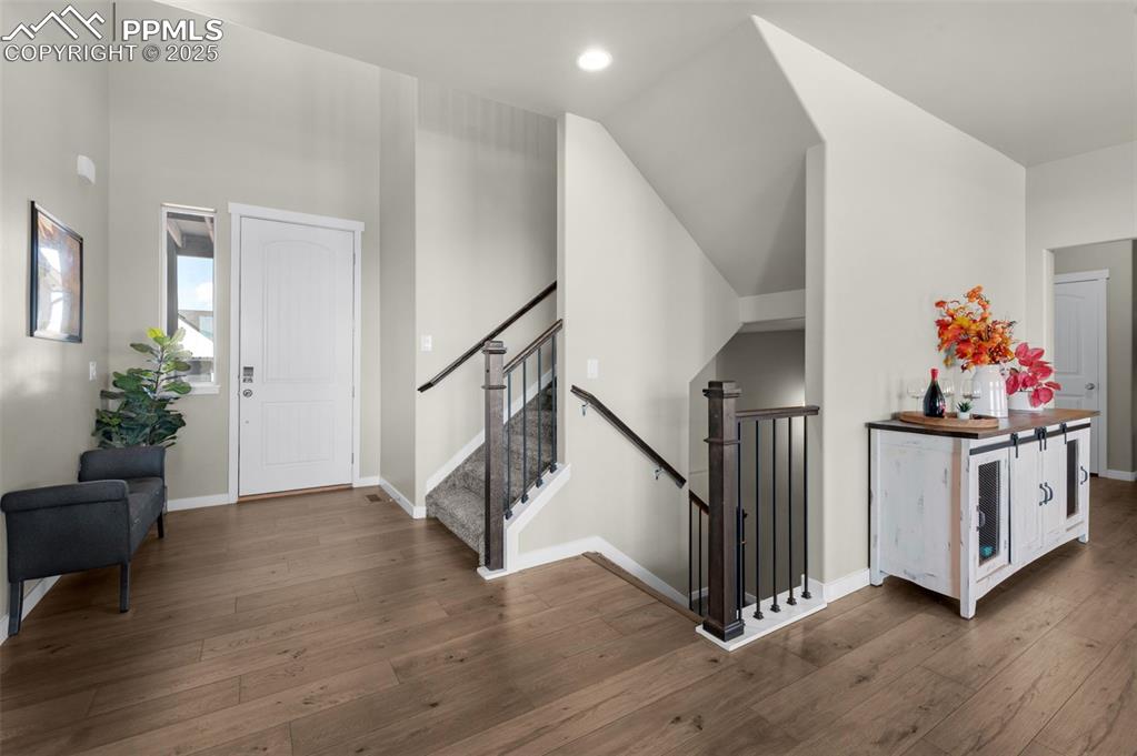Image 17 of 50: Wrought Iron Railing And Luxury Vinyl Plank Flooring