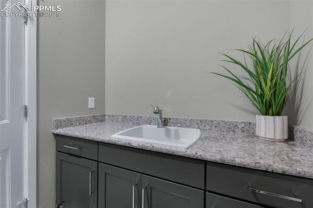 Image 34 of 50: Laundry Room With Granite Counters