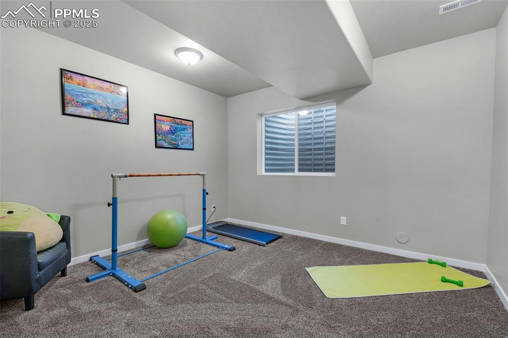 Image 41 of 50: Basement Bedroom 7 Currently Used As An Exercise Room