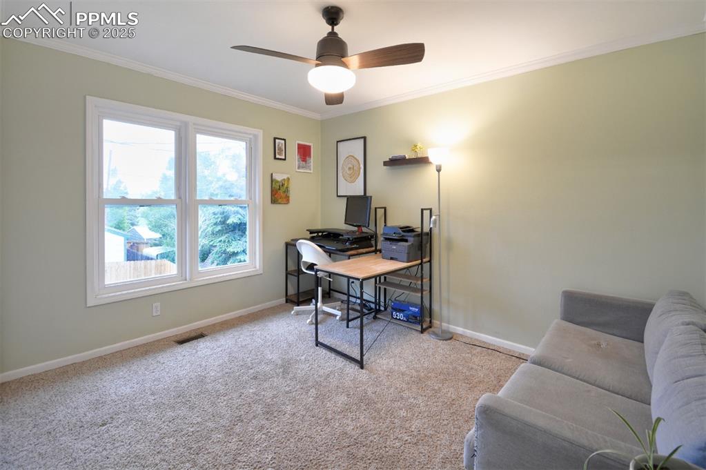 Image 16 of 32: Upper level 2nd bedroom is currently purposed as a office.