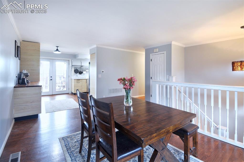 Image 9 of 32: Dining room/Living room open concept flows from the kitchen perfect for ent