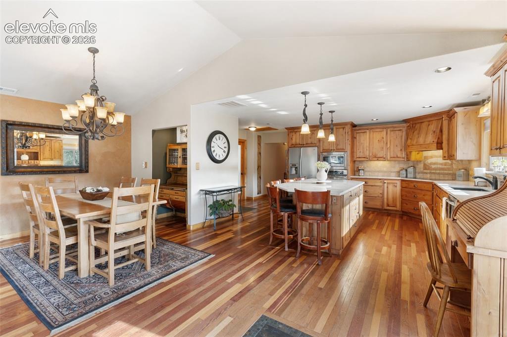 Image 12 of 43: Kitchen and dining room