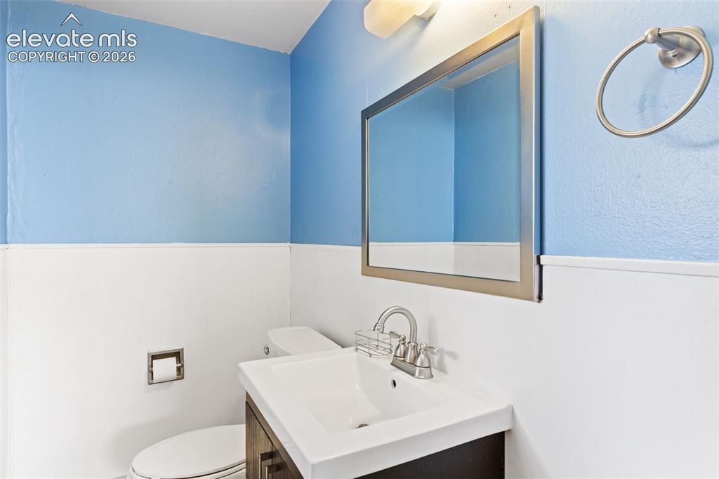Image 33 of 44: 1/2 bathroom in lower level