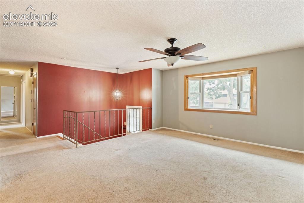 Image 9 of 44: Living room with bay window