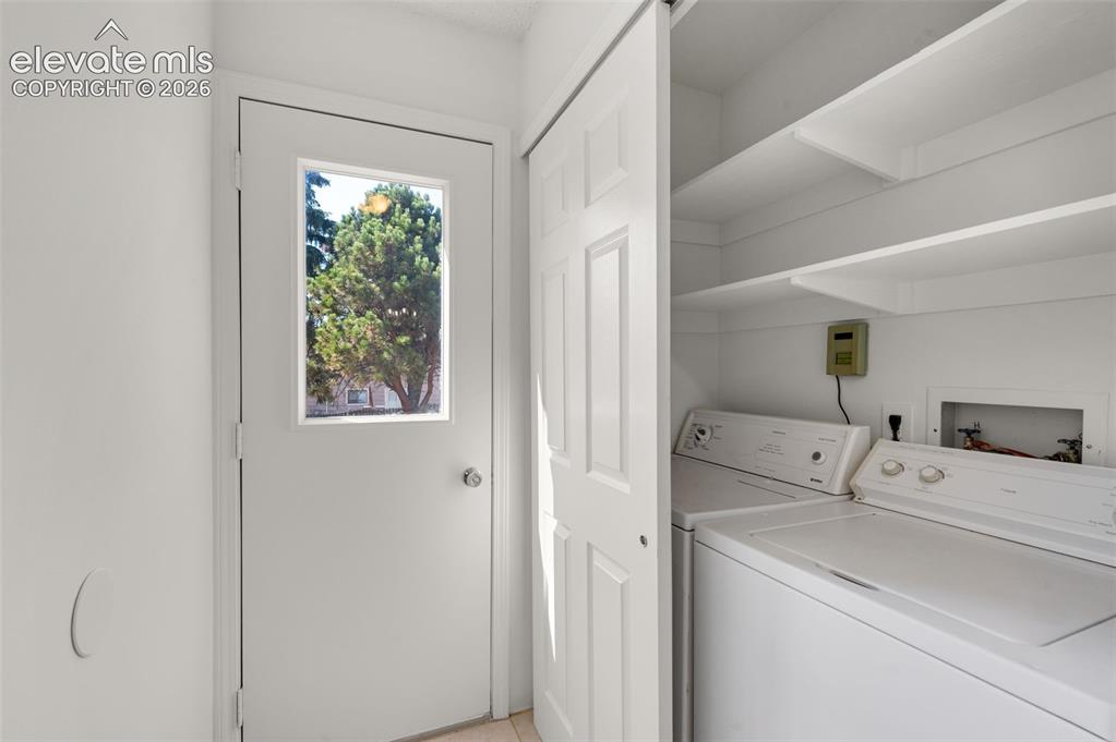 Image 20 of 36: Main level laundry and washer & dryer are included. Notice access door to