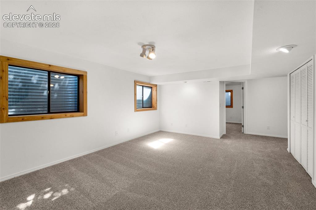 Image 21 of 36: Finished basement also with new carpet