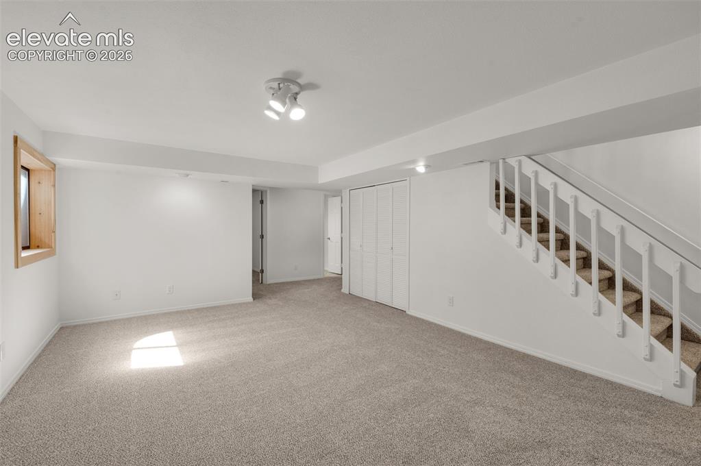 Image 22 of 36: Even the stairs down have new carpet