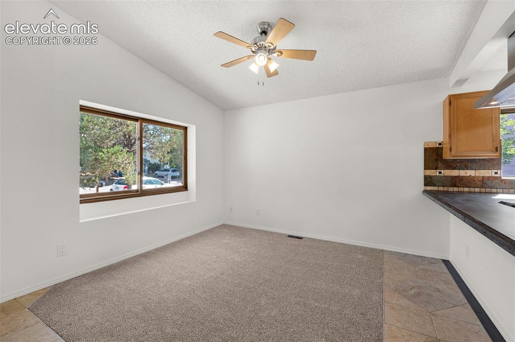 Image 6 of 36: Large window looks out to front yard