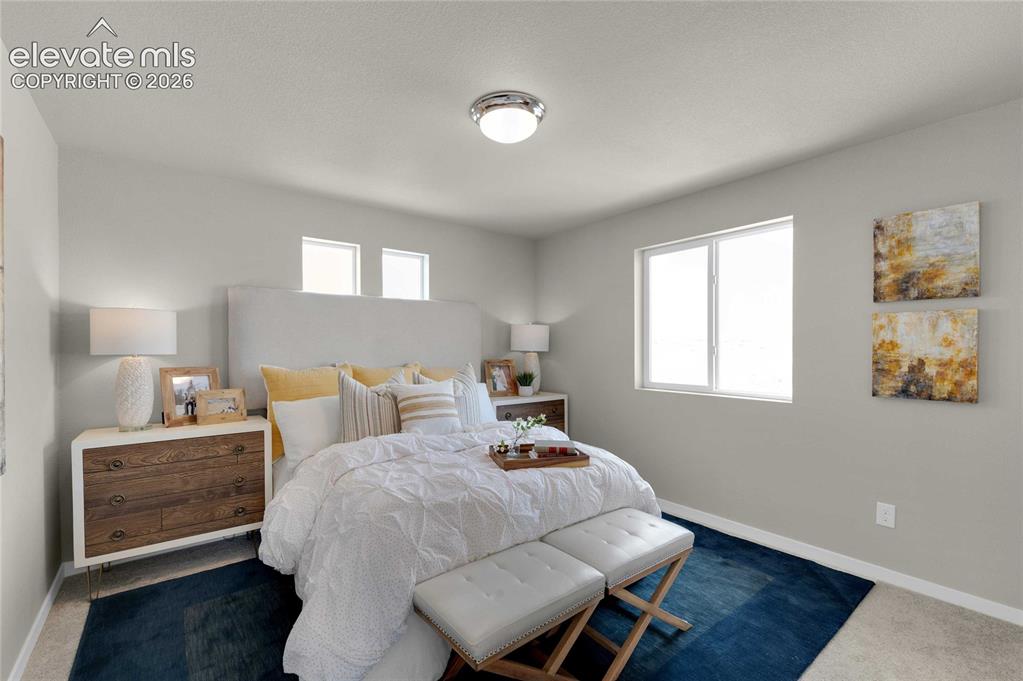 Image 17 of 31: Spacious room featuring neutral-toned walls and carpet flooring