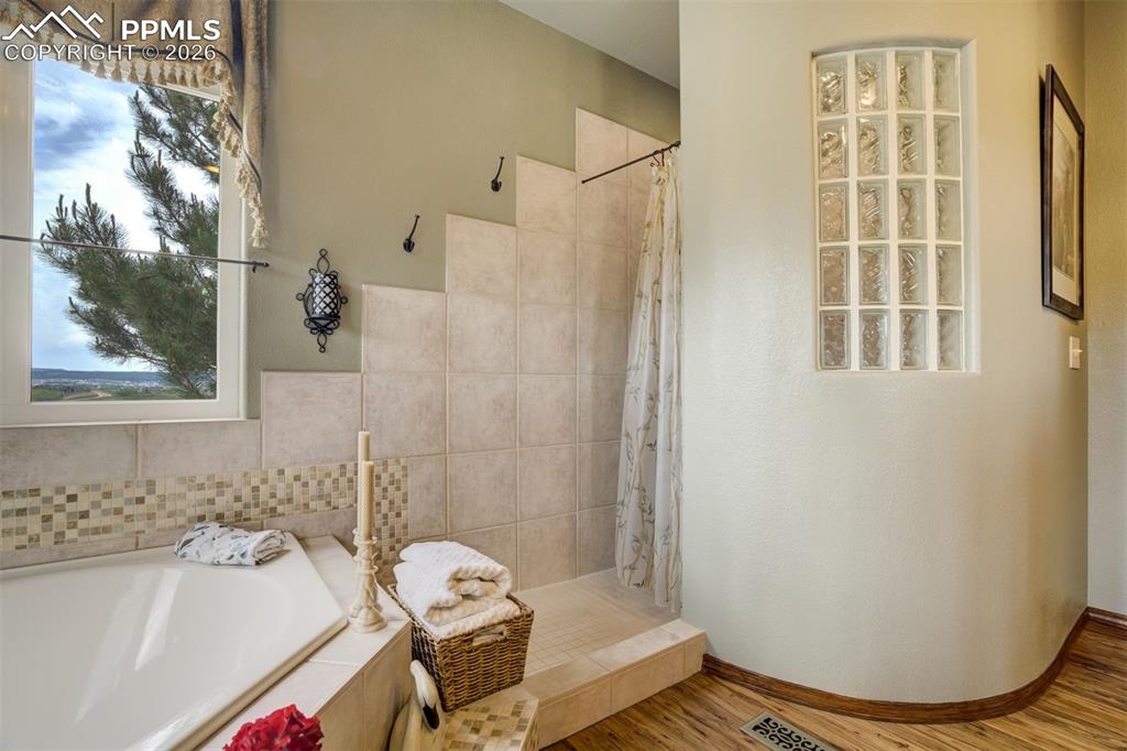 Image 18 of 40: 5 pc Master bath with soaking tub, double vanity, large walk-in shower, and