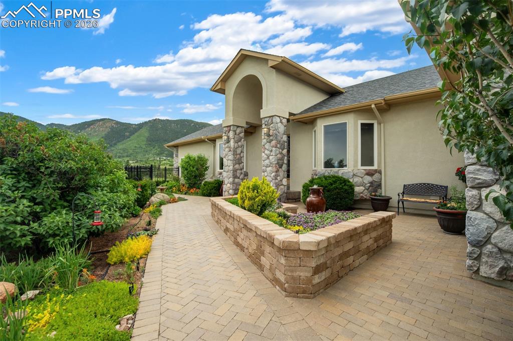 Image 3 of 40: The front patio is a gardener