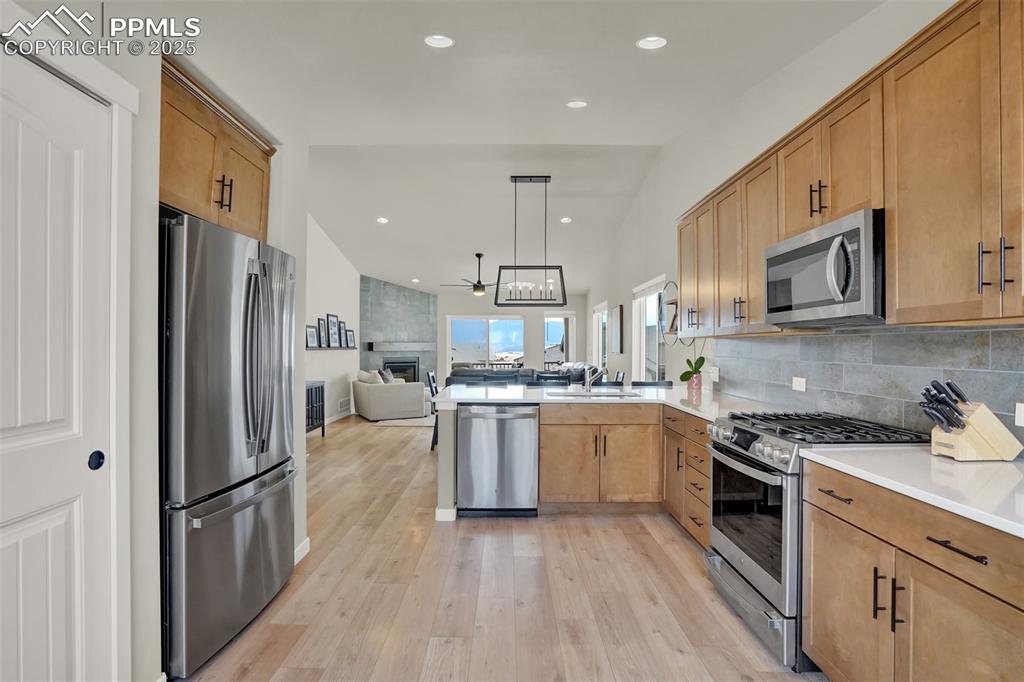 Image 16 of 42: View from kitchen to dining and living room