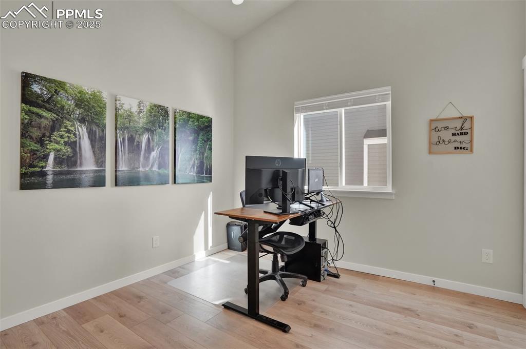Image 25 of 42: Spacious main level secondary bedroom or office.